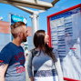 ... Couple looking at Bus Stop Timetable.jpg