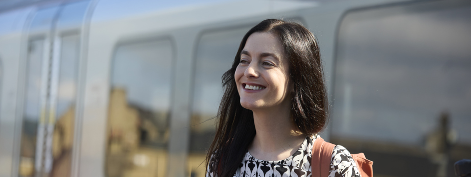 Smiling woman at Huddersfield Rail Stn